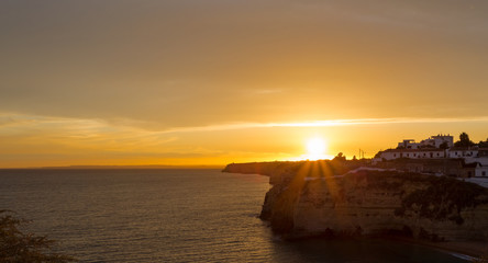 Fototapeta na wymiar Beautiful golden sunset over Carvoeiro in Portugal