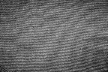 Black denim background of rough cloth