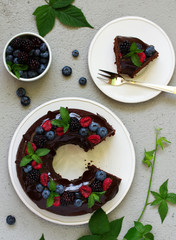 Chocolate cake with glaze and fresh berries