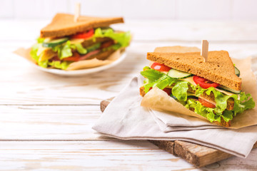 Rye bread sandwich with ham, cheese, lettuce