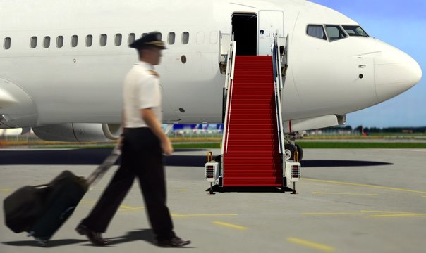 Pilot walking to airplane for take off