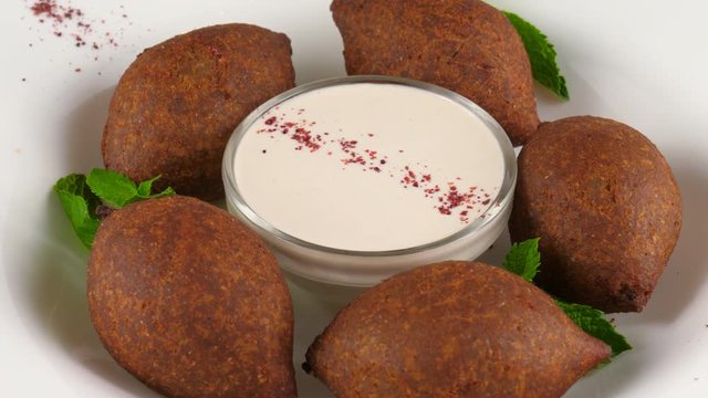 Icli kofte, Turkish traditional food, meatballs, minced meat and bulghur wheat, loop, 4K, ProRes codec, 422 HQ, ISO 100