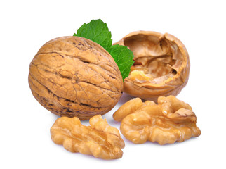 walnuts with green leaves isolated on white background