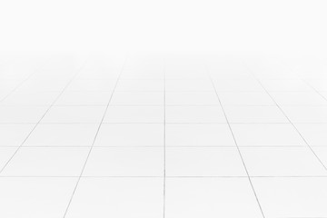 White tile floor background in perspective view. Clean, shiny, symmetry with grid line texture. For decoration in bathroom, kitchen and laundry room. And empty or copy space for product display also.