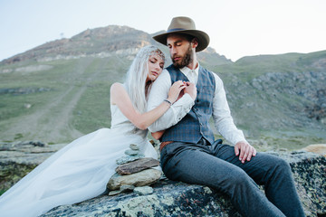 Wedding couple getting married in the mountains in Switzerland