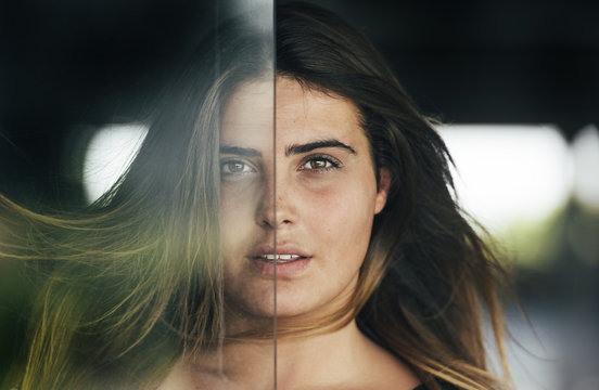 Fototapeta Portrait of woman behind glass