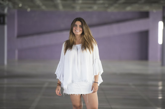 Charming model posing on parking