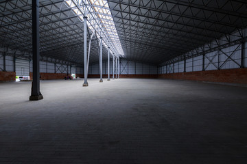 A huge warehouse. Metal construction. Grain dryer. Threshing floor. Blurred-unrecognizable faces of people. Concept theme is the production of food and agricultural production.