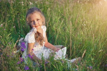 Fototapeta premium Little girl reading book