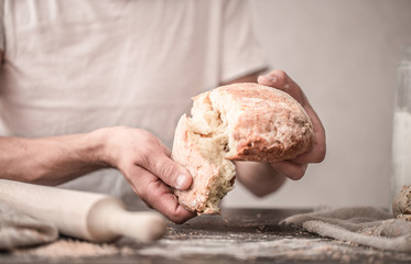 fresh bread in hands closeup on