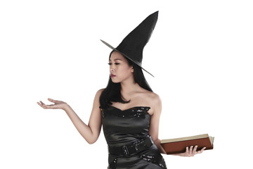 Portrait of asian witch woman with book and open palm