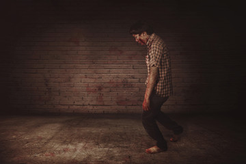 Aggressive creepy asian zombie man walking