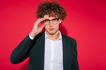 Handsome stylish man in white shirt and eyewear posing