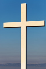 Cross as a symbol of Christianity with clear blue sky on background