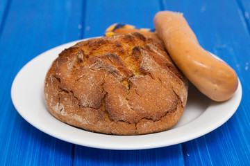 corn bread with smoked sausage farinheira on white plate