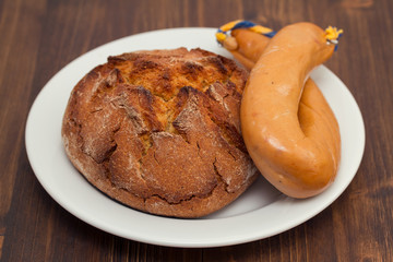 corn bread with smoked sausage farinheira on white plate