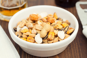salted nuts and seeds on white dish