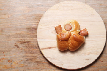 sausage bread on wood background