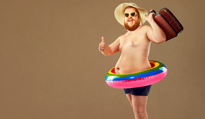 Funny bearded man prepared for beach vacation