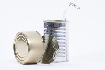 Two shiny empty aluminum food cans