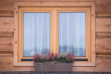 Wooden house window closeup, Poland