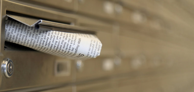post box and newspaper
