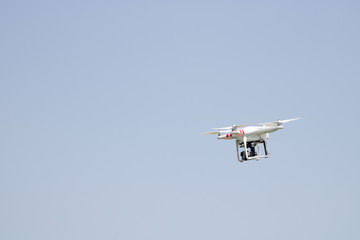 Small drone flying outdoors, technology concepts, copy space photo