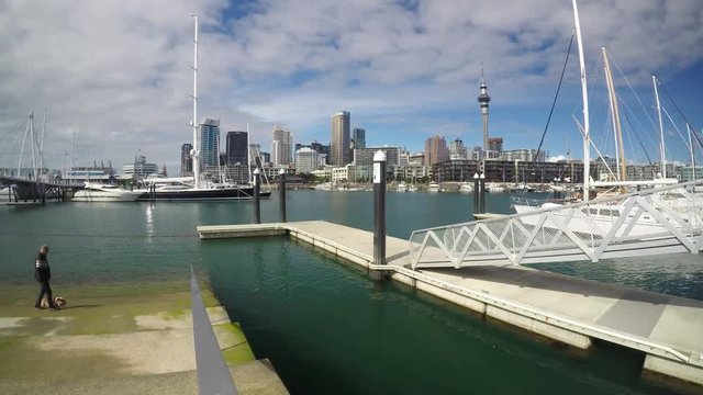 Time lapse of Auckland city downtown Skyline from Viaduct Basin Harbour. Auckland is the finance center of New Zealand with population of 1.5 million people.