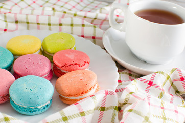 Cup of tea and a cake and macaroon