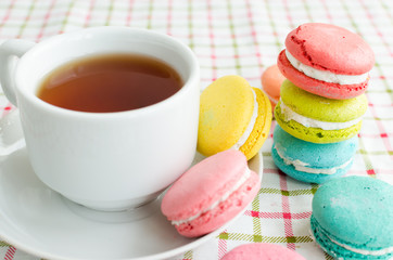 Cup of tea and a cake and macaroon