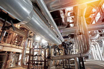 Equipment, cables and piping as found inside of a modern industrial power plant