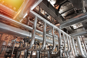 Equipment, cables and piping as found inside of a modern industrial power plant