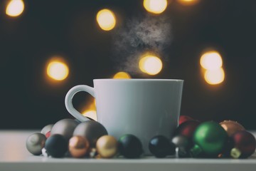 Obraz na płótnie Canvas White cup of coffee at Christmas decoration