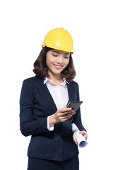 Smiling architect woman using smartphone isolated on white.