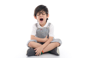 Happy asian boy sitting on white background