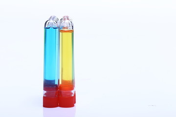 Obraz premium Blue Yelllow liquid in Group of Glass Tube red cap, Lab Test tools