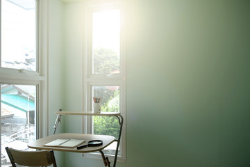 reading writing drawing thinking working with a note book in the morning room with sunshine