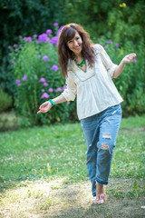 young girl is standing barefoot