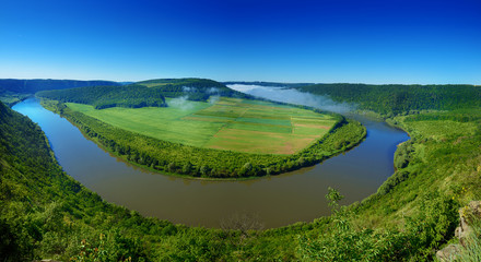 Fototapeta na wymiar Dnister river landscape in Ternopil region of western Ukraine. Idillyc view from above in the morning. Panorama