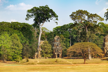 Fototapeta na wymiar Prasat Suor Prat is located at eastern side of royal square in Angkor Thom, right in front of Terrace of Elephants and Terrace of Leper King, Siem Reap, Cambodia. Khmer architecture, World Heritage