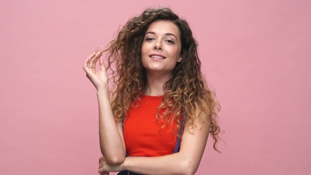 Young cheerful caucasian woman over pink background
