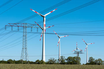 Windwheels and power transmission lines seen in rural Germany