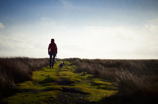 A hiker exploring the English Countryside, Muggleswick Common near Edmundbyers, England UK.