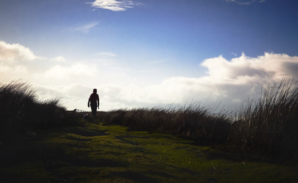 A hiker exploring the English Countryside, Muggleswick Common near Edmundbyers, England UK.