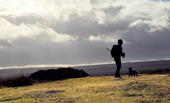 A hiker exploring the English Countryside, Muggleswick Common near Edmundbyers, England UK.