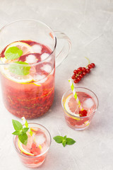 Red currant mojito. Selective focus, space for text.