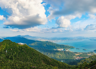 Panoramic view of blue sky, sea and mountain seen from Cable Car viewpoint, Langkawi, Malaysia. Picturesque landscape with beaches, small Islands and tourist ships at waters of Strait of Malacca