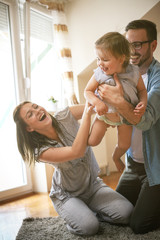Happy family spending time with their little baby. - 166988129