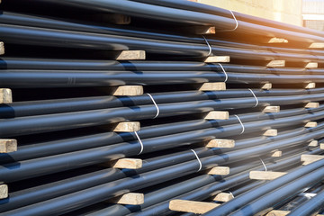 Plastic pipes in stock of finished products stacked in packs