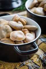Broad beans served in black bowls.